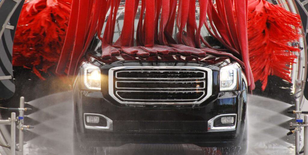 Truck driving through ScrubaDub car wash